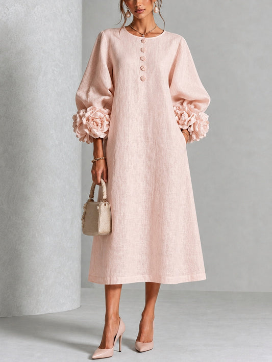 Vestido midi rosa con botones frontales y puños florales llamativos