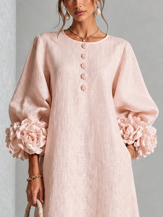 Vestido midi rosa con botones frontales y puños florales llamativos